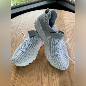 White and gray slip on sneakers